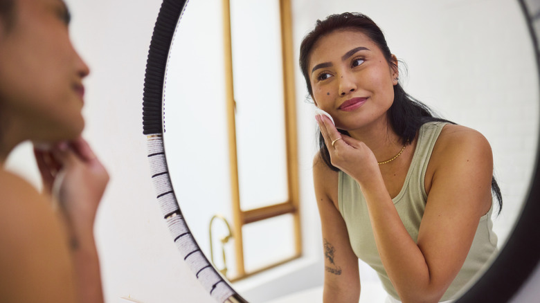 Woman applying toner