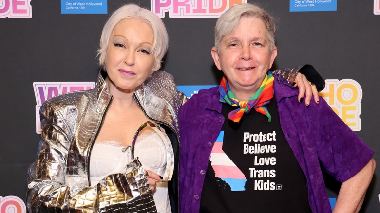 Cyndi Lauper with her arm around her sister Ellen Lauper on the red carpet