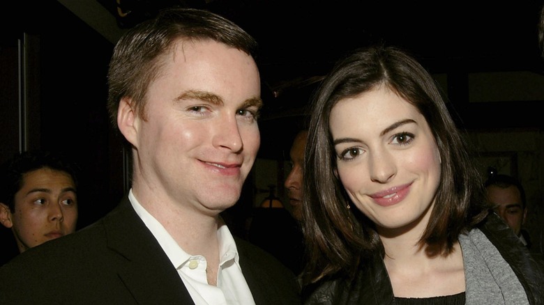 Michael Hathaway smiling alongside his sister Anne Hathaway