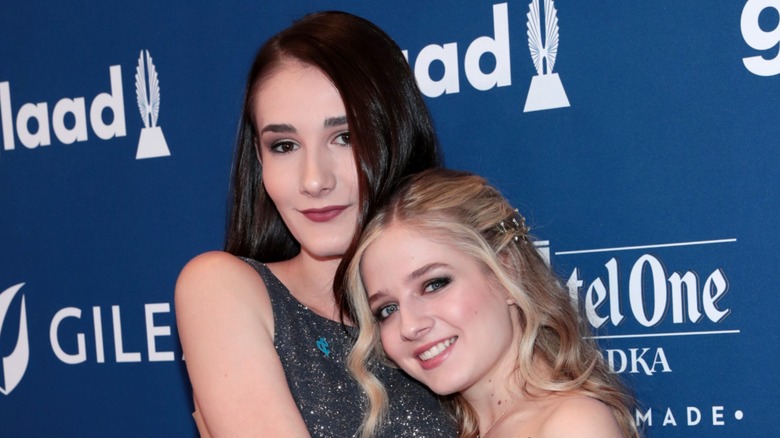Juliet Evancho and Jackie Evancho hugging on the red carpet