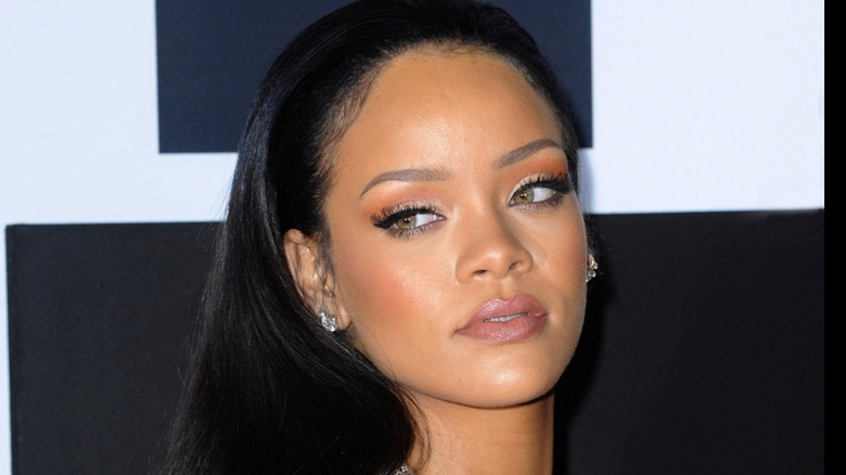 Rihanna wearing lash extensions and with natural lashes