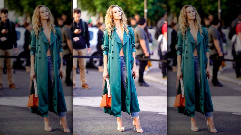 Blonde in teal duster