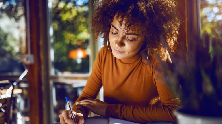 A woman writing 