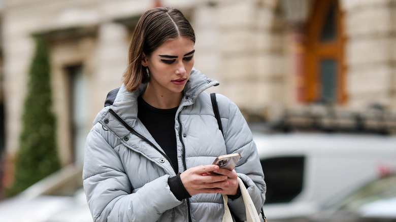 A woman texting 