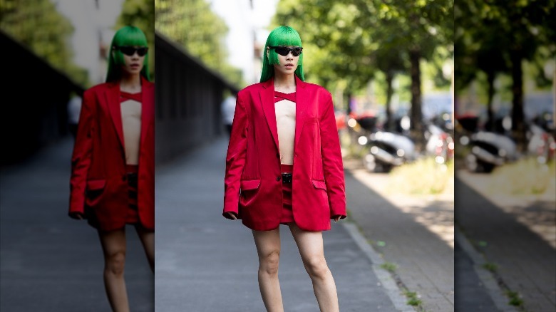 Ally Space in red mini skirt