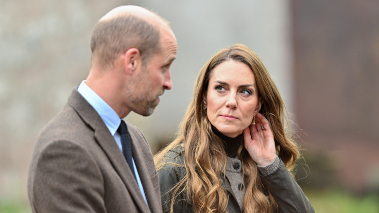 Prince William outdoors and speaking to Kate Middleton