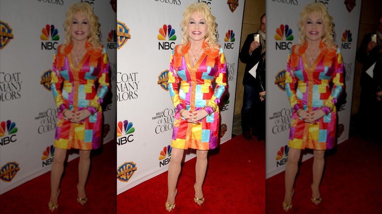 Dolly Parton on the red carpet in a patchwork shirt dress