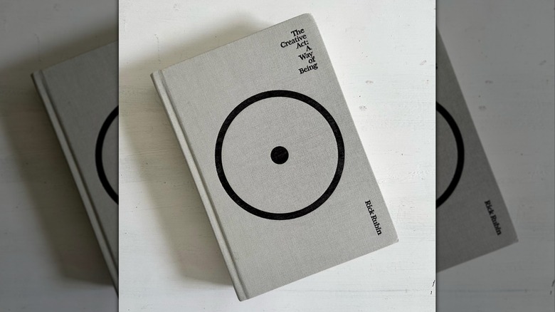 A copy of "The Creative Act" laying on a white table