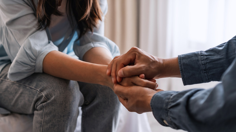 Couple holding hands
