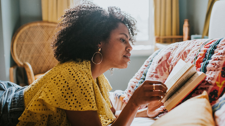 Woman in bed reading