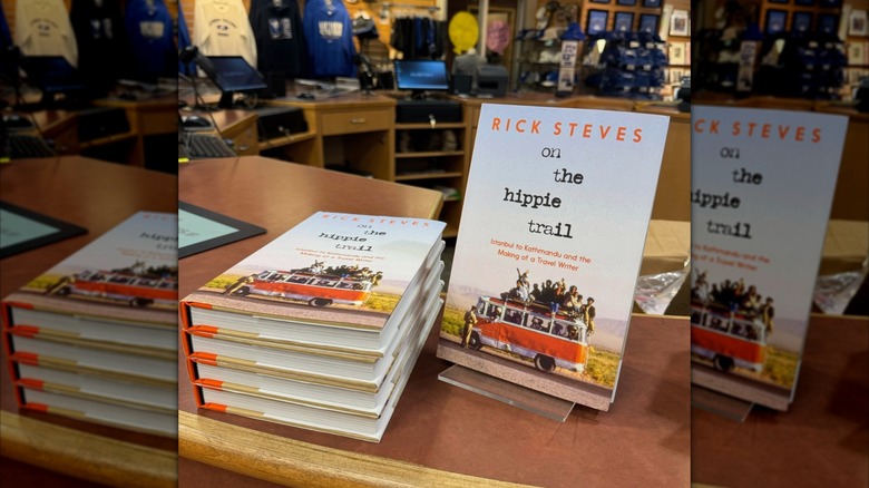 Several copies of "On the Hippie Trail" stacked on a table