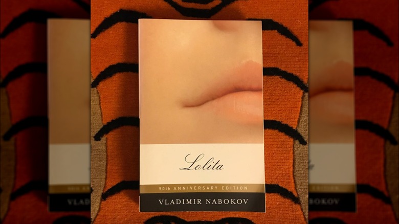 A copy of "Lolita" laying on a orange rug