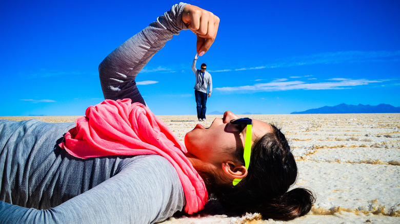 Woman pretending to eat man