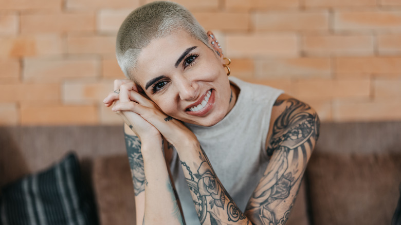 Smiling tattooed woman