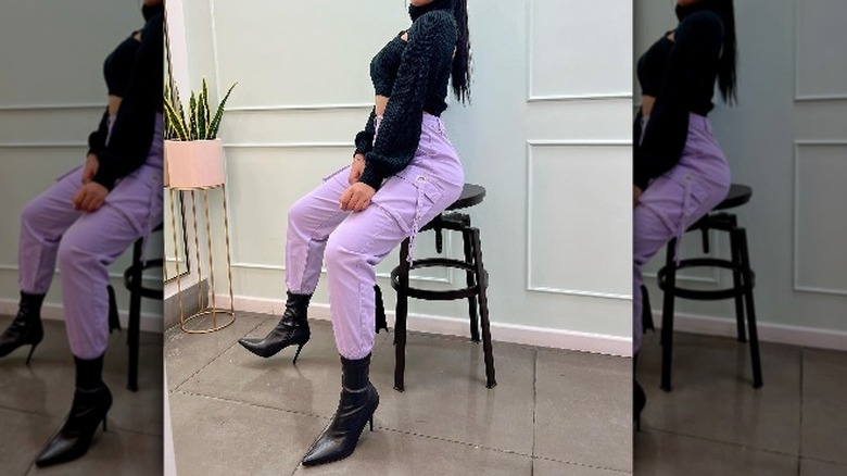 Woman in lavender pants 