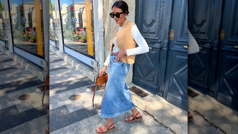 Woman in long denim skirt 