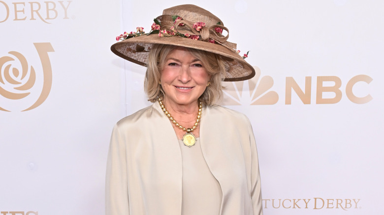 Martha Stewart in a brown floral hat