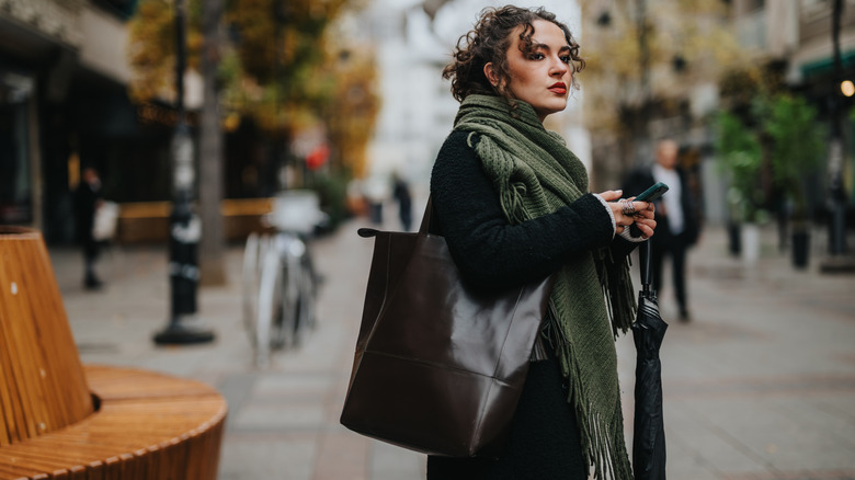 woman carrying a large bag