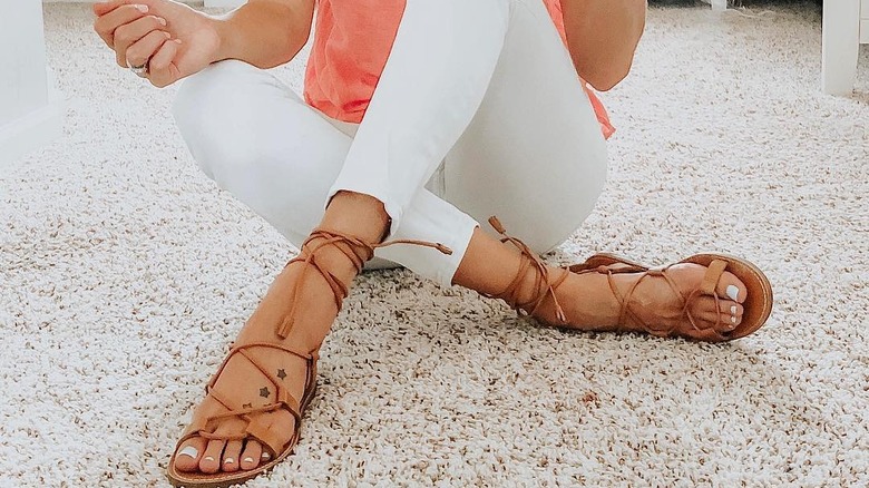 gladiator sandals on legs