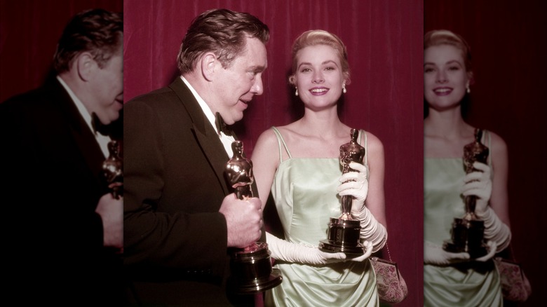 Marlon Brando walking alongside Grace Kelly on the red carpet at the 1955 Oscars