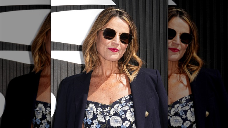 Savannah Guthrie Rocking a bold red lip with big sunglasses at the 2024 US open