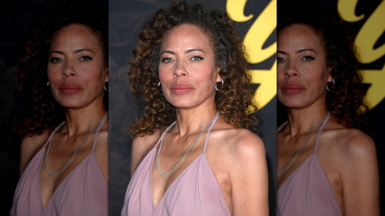 Tawny Cypress looking into the camera at a 2025 "Yellowjackets" event