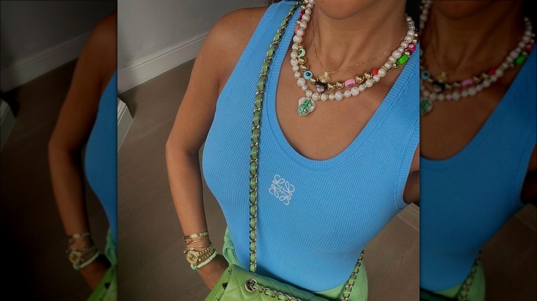 Woman wearing statement necklaces
