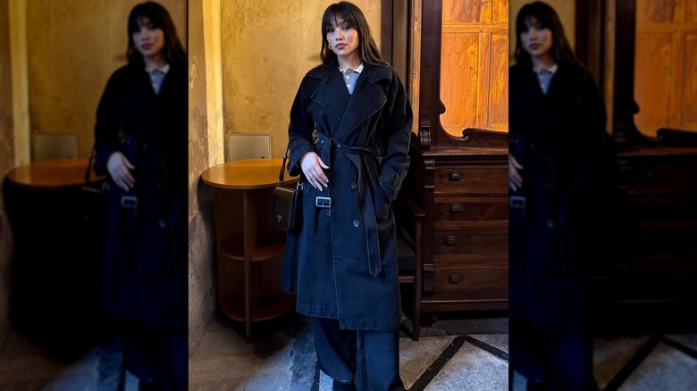 Lauanda Rios wearing a trench coat and flared pants