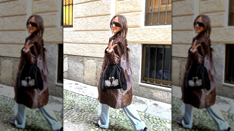Izzi Allain wearing a leopard-print jacket with black sunglasses