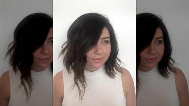 A woman with an asymmetrical long bob