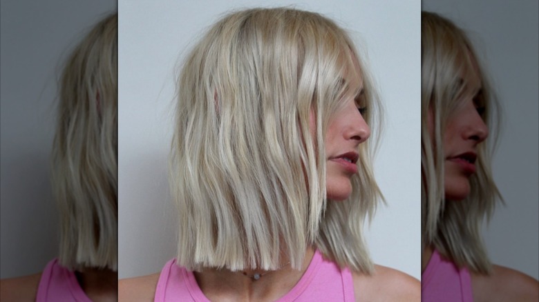 A woman with blonde hair that is shoulder length