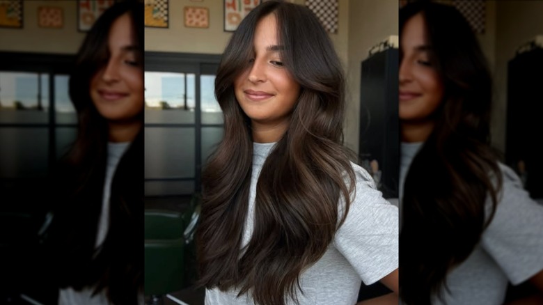 A woman with long brown hair that's softly curled