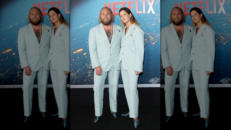 Jonah Hill and Sarah Brady, in matching pale blue suits, attend the world premiere of Netflix's "Don't Look Up" in December 2021