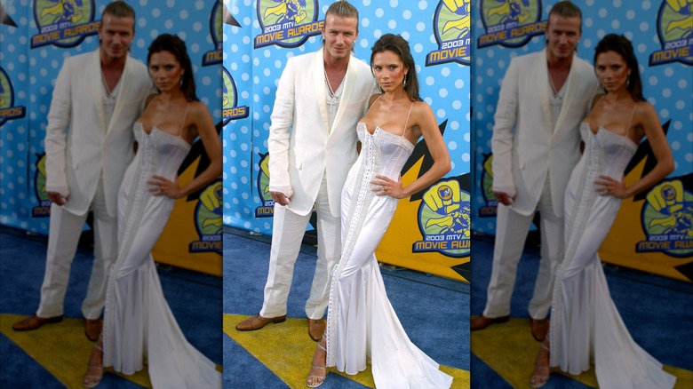 Victoria and David Beckham in matching white outfits in 2003