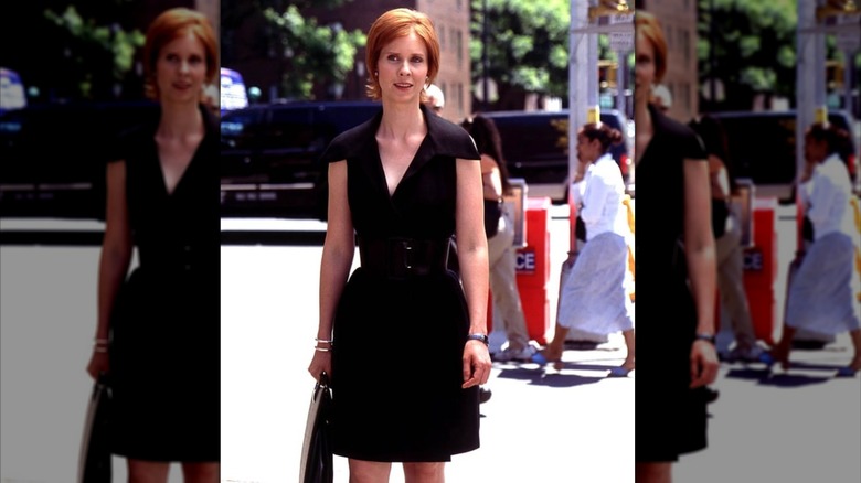 Miranda Hobbes on a New York street in a black dress