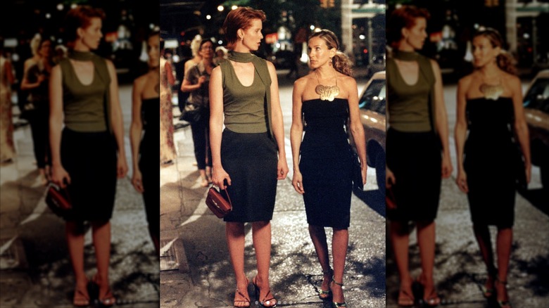 Carrie Bradshaw and Miranda Hobbes walking down a New York street at night