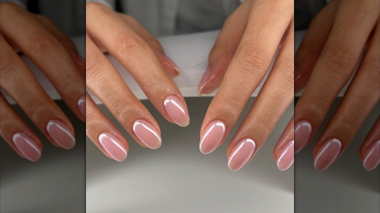 Pale pink nails with a metallic chrome finish