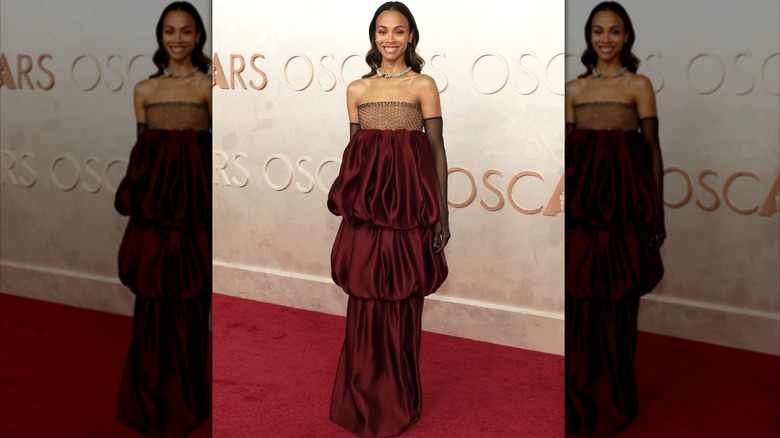 Zoe Saldana in a red dress at the 2025 Oscars
