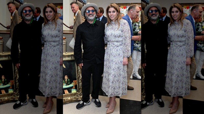Beatrice poses in beige pumps and maxi dress