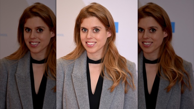 Beatrice wears cutout black top