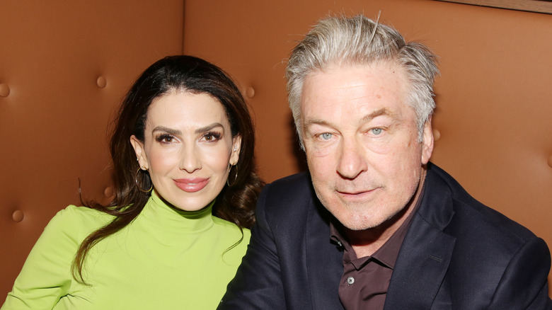 Hilaria Baldwin and Alec Baldwin posing for a photo together in a booth in March 2025