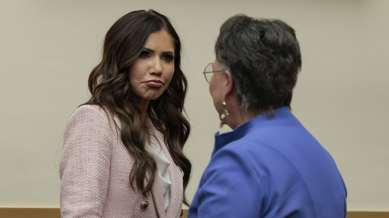 Harriet Hageman speaks with Kristi Noem during a break from her testifying during a House Judiciary Committee hearing in March 2026