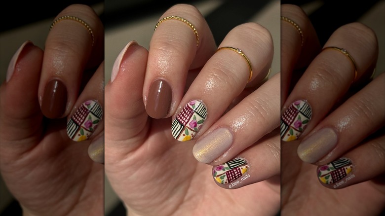 Hand showing two accent nails with quilt-inspired design