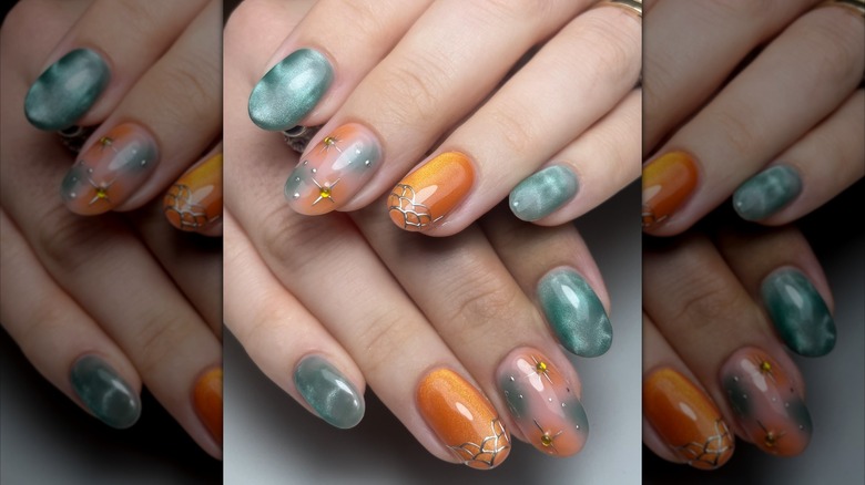 Two overlapping hands with varied orange and teal designs