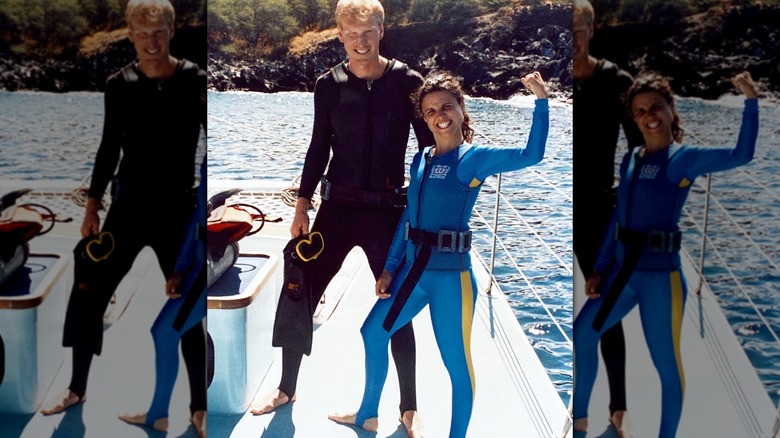 Julia Louis-Dreyfus and Brad Hall posing for the camera while on the water