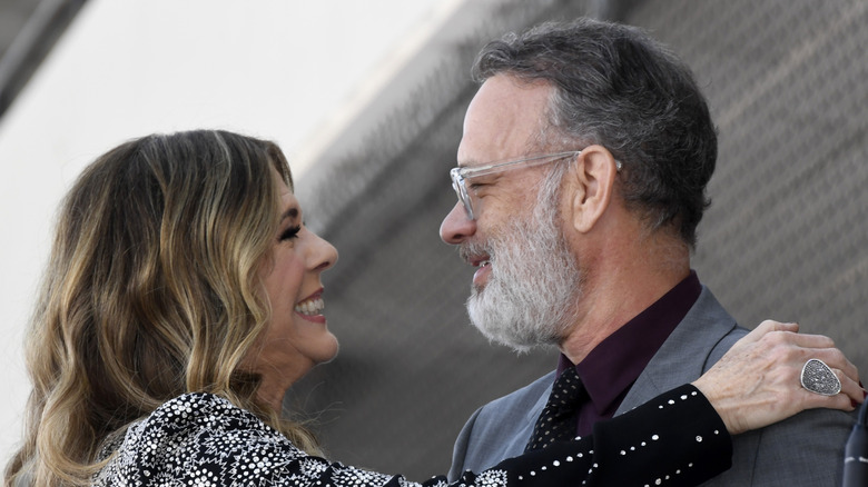 Tom Hanks and Rita Wilson smiling at each other
