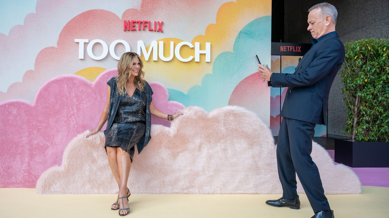 Tom Hanks taking a photo of Rita Wilson