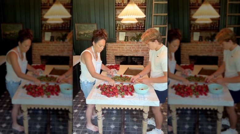 Joanna Gaines with her son cutting strawberries