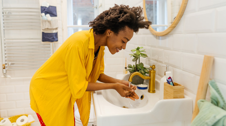 Woman washing her face 