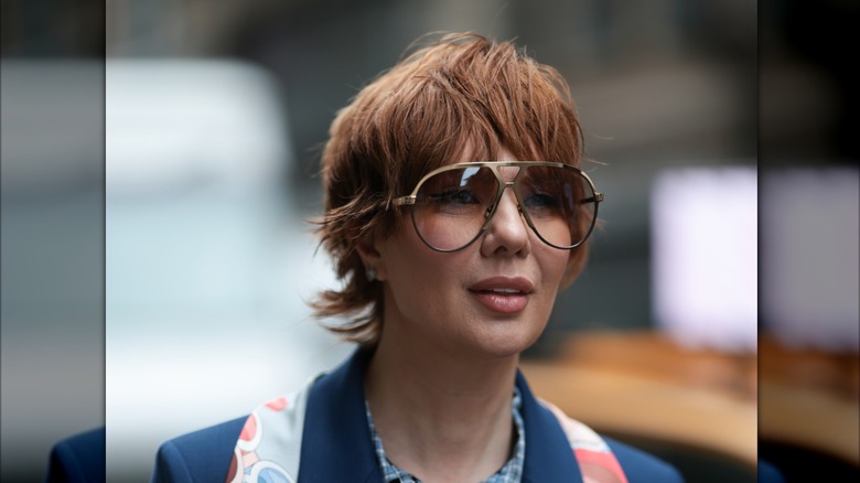 Woman with short hair and large sunglasses